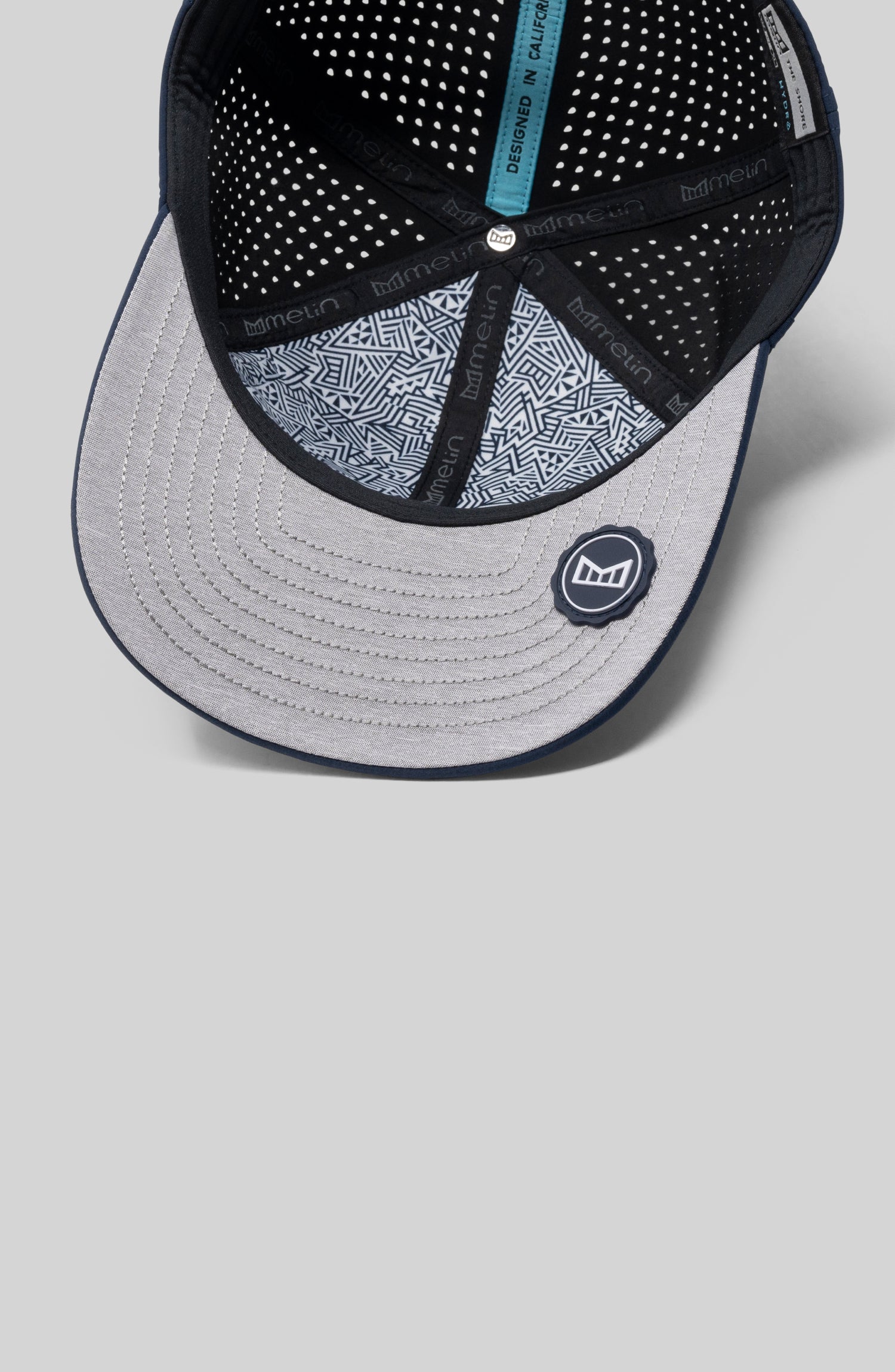 The undervisor view of the melin Compass Hydro in Navy against a grey background